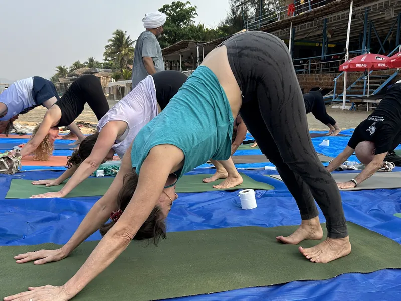 Opening ceremony at Purnam Yogashala — students with marigold garlands at 200 hour yoga teacher training Goa