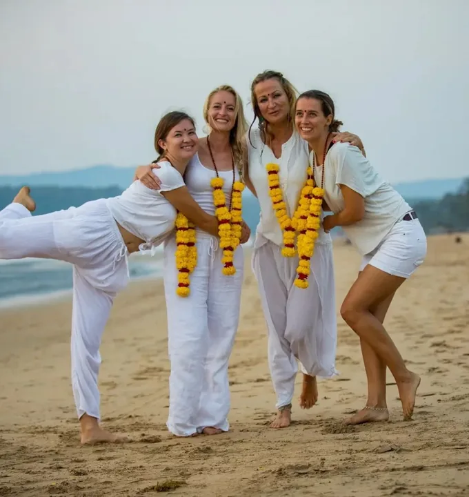 Yoga students celebrating at Agonda Beach after completing 100 hour yoga teacher training Goa at Purnam Yogashala